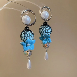 Elegant floral drop earrings with blue leather petals, pearls and crystals details