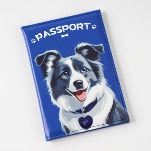 Close-up of blue PU leather passport cover with a cute border collie dog illustration