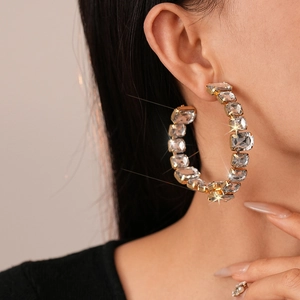 Exaggerated golden C-shaped hoop earrings with sparkling square inlaid crystals for women