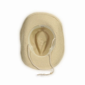 Close-up of beige straw sun hat showing adjustable windproof strap and 100% paper tag
