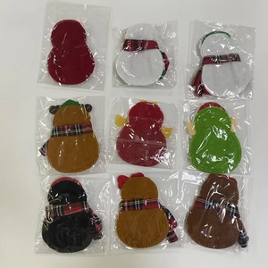 Detail of 9-piece Christmas cutlery holder set featuring creative cartoon felt designs
