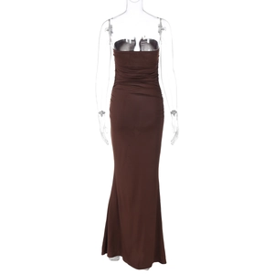 Detailed close-up of dark brown bodycon maxi dress featuring textured ruching on the fabric
