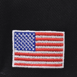 Macro shot of detailed USA flag embroidery on durable black cotton twill fabric