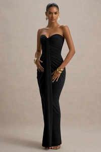 Detail shot of the twist-knot pleated design and elegant draping on the black tube dress