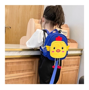 Detail view of toddler safety backpack with yellow chick cartoon and anti-lost leash
