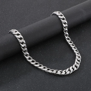 Detailed close-up of 15mm polished silver Cuban link chain on a professional stand