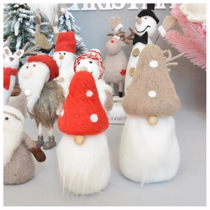 Detail of wool felt Christmas gnomes, snowmen and reindeer festive tree ornaments