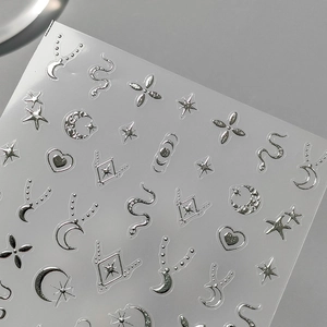 3D silver embossed nail stickers featuring gothic stars, moon, and heart designs