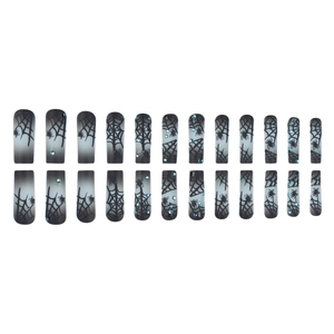 Halloween press-on nails with black gradient, spider web patterns and rhinestones
