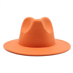 Detailed close-up of orange wool felt fedora showing reinforced stitching on the wide brim