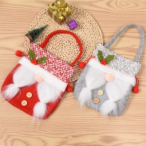 Festive Christmas gnome gift bags in red and grey plush fabric with wooden button details