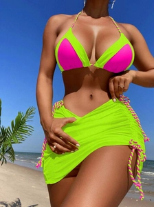 Detailed view of neon color block bikini set with sheer mesh waist tie sarong skirt