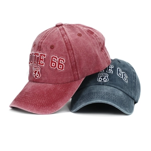 Detail of Route 66 embroidered lettering on washed vintage denim baseball caps