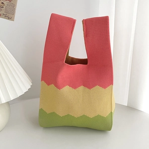 Chic tricolor knit tote bag featuring pink, beige and green wave pattern design