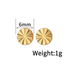 Detail view of 6mm golden textured disk stud earrings weighing 1g with dimensions