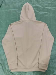 Back view of a casual light beige fleece hoodie with minimalist pocket details for men