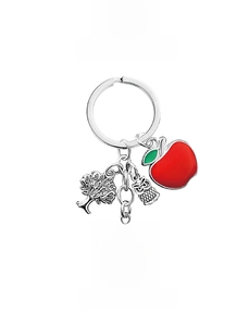 Detail of teacher keychain with tree owl charms and Teach Love Inspire circular tag
