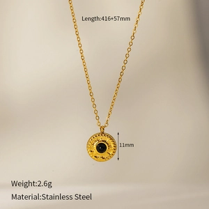 Macro view of gold-plated stainless steel sunflower pendant with black stone inlay detail