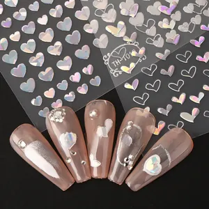 Macro shot of laser holographic heart nail stickers TH-101 with 3D pink manicure effect