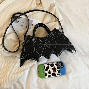 Gothic bat-shaped handbag in black leather with white spider web embroidery