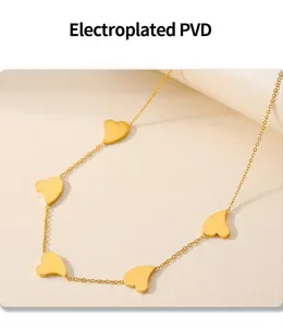 Detailed macro view of heart pendant chain with 18k gold PVD plating and irregular charms