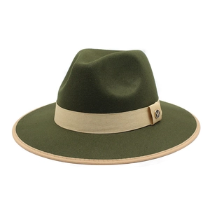 Detail of olive wool fedora hat with beige ribbon trim and a metal M logo emblem