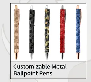 Detail of five glitter-covered metal ballpoint pens in gold, black, leopard, red, and blue