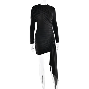 Detail of black long sleeve mini dress featuring ruched pleats and asymmetric drape