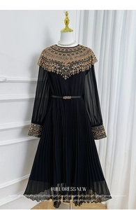 Detail of gold beadwork and sequins on black chiffon pleated maxi dress with belt
