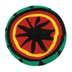 Macro shot of Rastafarian style knit hat with green yellow red stripes and black leaf detail