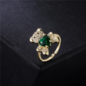 Golden bear ring with green heart gemstone and white zircon micro-pave in open design