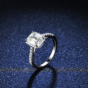 Elegant emerald cut moissanite ring in 925 sterling silver with micro-pave diamonds