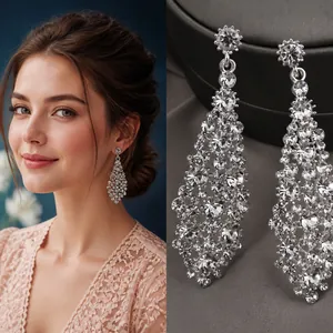 Detail of silver long tassel earrings with sparkling rhinestones in a drop shape