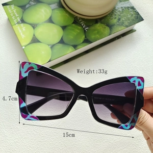 Detail shot of cat eye glasses showing 15cm width and 4.7cm height measurements