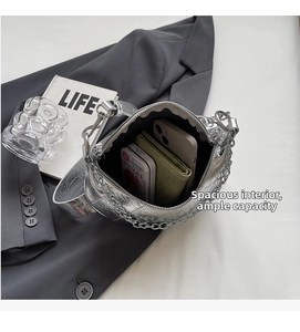 Macro view of silver metallic crackle texture handbag interior showing daily storage capacity
