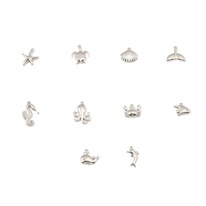 Polished silver ocean charms set featuring starfish turtle shell and sea life pendants