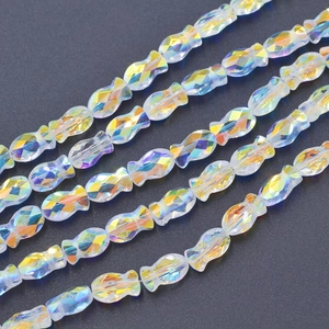 Macro shot of 6x10mm fish-shaped iridescent AB color glass beads for DIY jewelry making