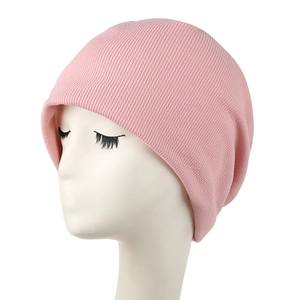 Close-up of pink fine rib knit beanie on a white mannequin head showing soft texture