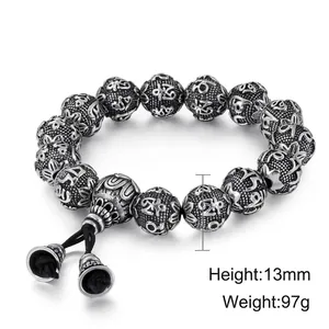Vintage stainless steel beaded bracelet with carved mantra beads on black braided rope
