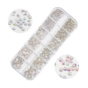 Detailed view of 12-grid storage box with various sizes of AB crystals for nail art