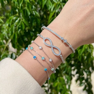 Elegant S925 sterling silver Mobius infinity bracelet set with opal and cubic zirconia