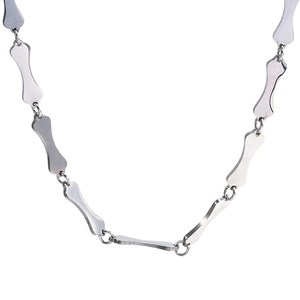 Polished silver stainless steel necklace with unique bone-shaped links on white background
