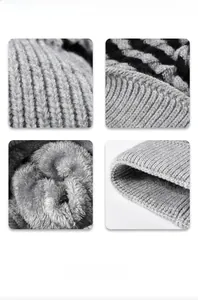 Detailed view of the thick gray knit hat featuring a soft white faux fur thermal lining