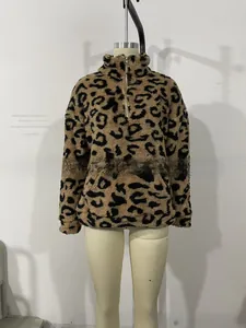 Detail of the leopard print faux fur texture and quarter-zip stand collar on the pullover