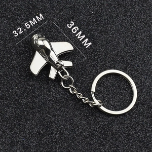 Detailed dimensions of silver metal airplane keychain showing 36mm length and 32.5mm wingspan