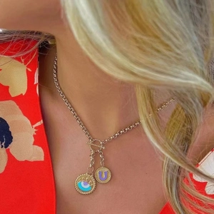 Gold stainless steel evil eye necklace with purple letter U pendant and T-bar clasp