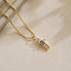 Golden robot pendant necklace with blue gemstone and zircon on box chain