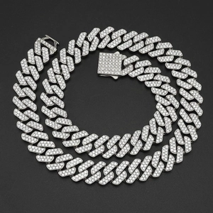 Close-up of silver diamond-encrusted Cuban link necklace with classic square box clasp