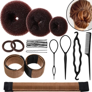 Flat lay of professional hair styling tools set including sponges and plastic tail combs