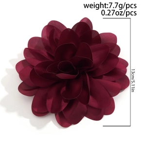 Macro detail of 13cm dark burgundy rose brooch showing 7.7g weight and size labels
